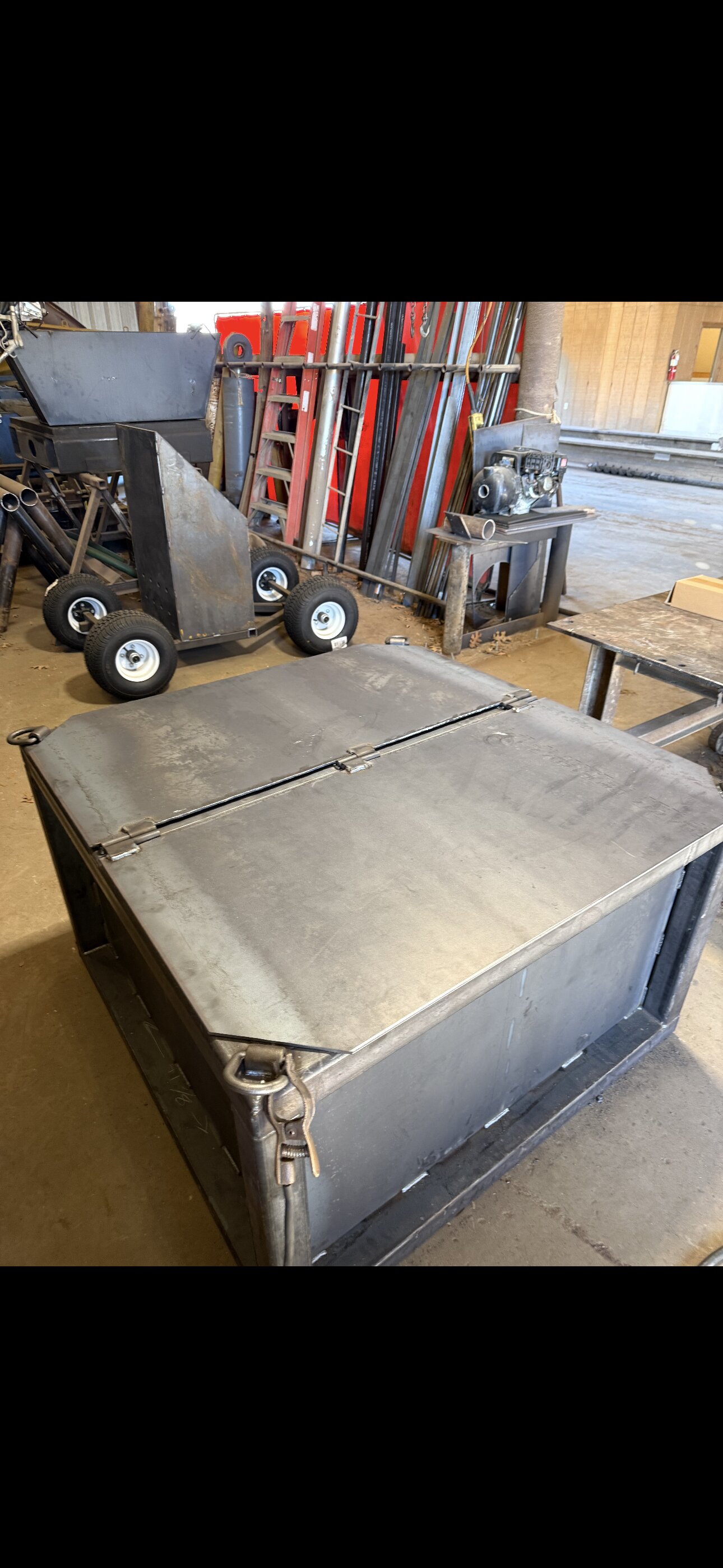 Custom steel fabrication with hinged lid and latches